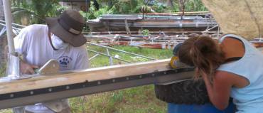 Jon and Amanda continue their polishing efforts on the mast