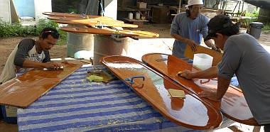 Baw, Lek & Pla sanding the people doors under Ocelot's bows