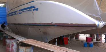 Port topsides masked and ready for spraying with gelcoat