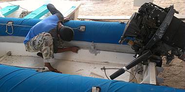 Baw and Heru started working on Tom Cat, our big dinghy