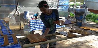 Moving newly finished floorboards out to make room for others