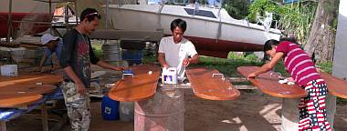 Preparing the doors for their final coats of satin varnish