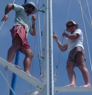 Jon & Colin up the mast, watching for coral