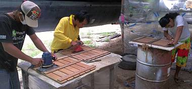 Heru, Yando & Chambron sanding the teak slat floorboards