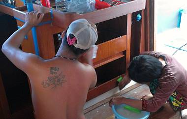 Heru and Yando sanding under the nav-desk