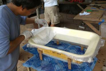 Houa making a splash mold from a piece of interior hatch trim
