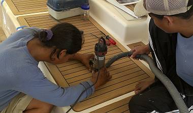 Houa & Heru routing out the battery hatch to mount the pulls