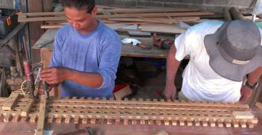 Houa finishing up the assembly of our teak lattice