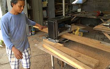 Houa planing down the teak for the entryway frame