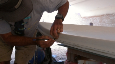 Jon marking where the cuts must go on the sides of the bimini