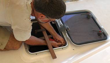 Screwing the new internal hatch trim to the hatch