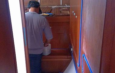 Pla sanding rough varnish in the starboard aft cabin