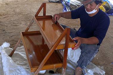 Pla sanding the galley shelves, preparing them for varnish