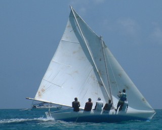 A small sloop racing in the Carriacou Regatta