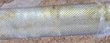 Corrosion on the knurled surface of a swim ladder step