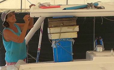 Sue picking foam coring out of the bimini with her dental pick