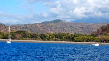 Viannica and Pacific Lily behind Tanjung Gumuk